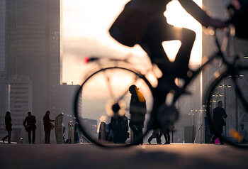 Art Photography Businessman on bicycle passing skyline La Defense