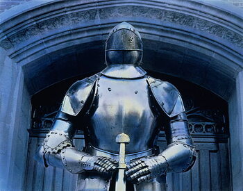 Canvas Print Armor suit standing beneath Gothic archway