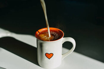 Canvas Print Dairy Free Milk Pouring in a Hot Tea Mug