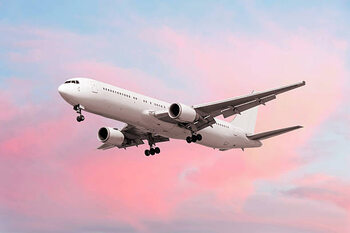 Canvas Print XXL jet airplane landing at dusk