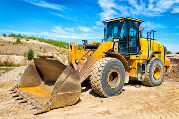 Canvas Print Yellow earth mover prepares the ground