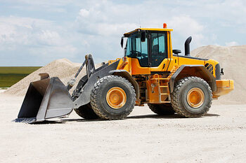 Canvas Print Yellow front loader at gravel pits