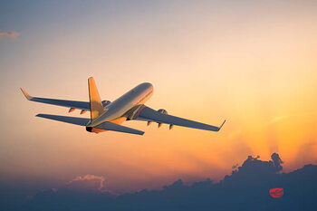 Sticker Passenger airplane flying above clouds during