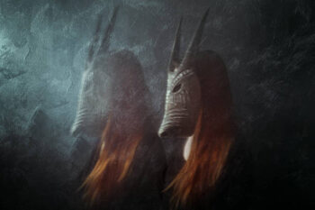 Plakat Redhead woman wearing mask, long exposure