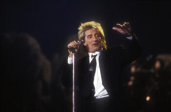 Poster Portrait of rock singer Rod Stewart on stage in 1990.