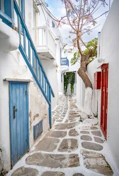 Poster Small alley with white Cycladic houses