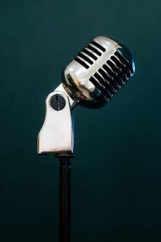 Наклейка Professional microphone on a black background.