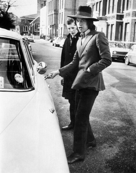 Наклейка Jagger, singer with the Rolling Stones, about to get into his car, c.1970