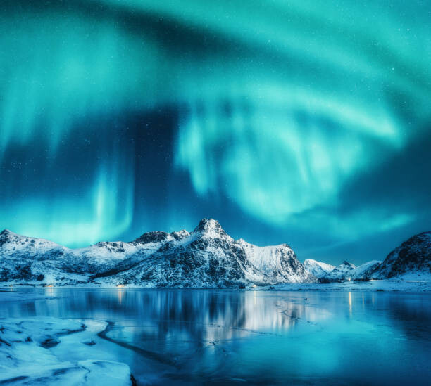 Art Photography Aurora borealis above snowy mountains, frozen