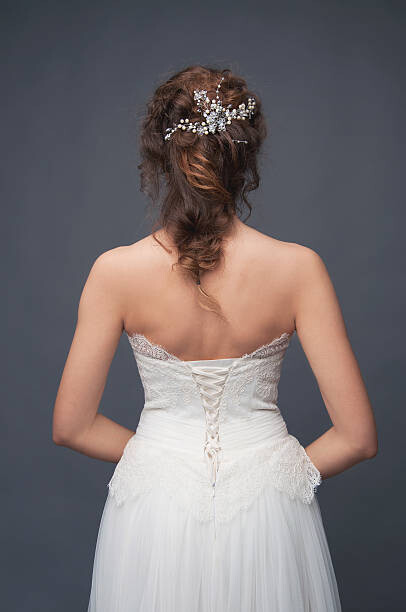 Art Photography Bridal fashion. Brunette bride view from the back.