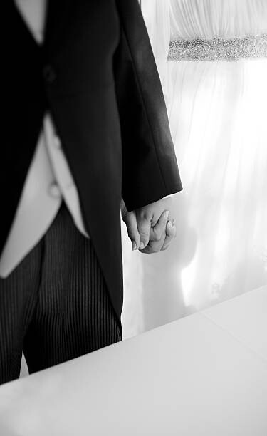 Art Photography Bride and groom holding hands in