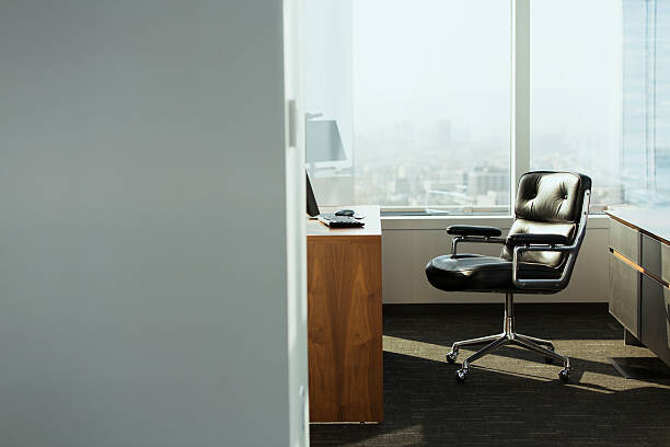 Art Photography bright corner office space with desk and chairs