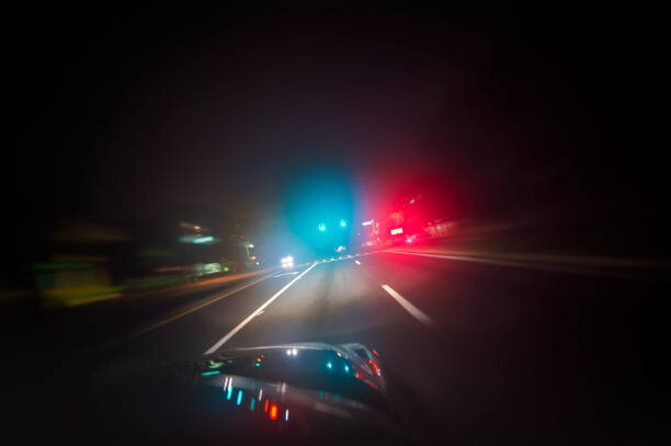 Art Photography Car driving down road with red and blue lights