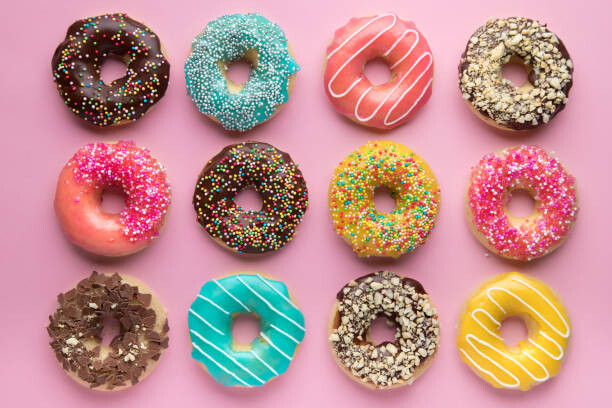 Art Photography Colorful sweet background. Delicious glazed donuts