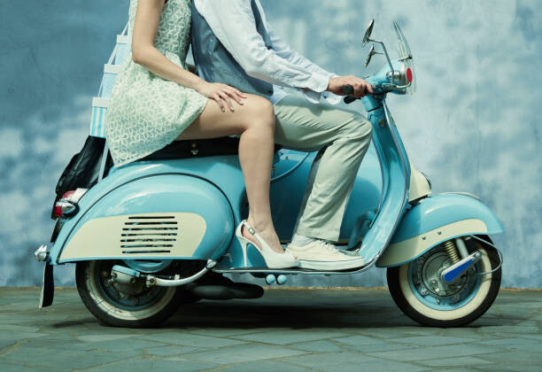 Art Photography Couple riding vintage scooter