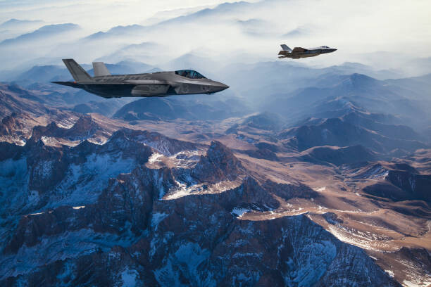 Art Photography Fighter Jets flying over mountains at dusk