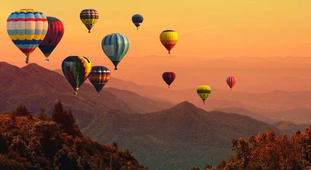 Art Photography Hot air balloon above high mountain at sunset