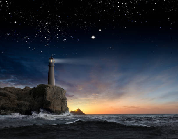Art Photography Lighthouse beaming over rocky ocean waves
