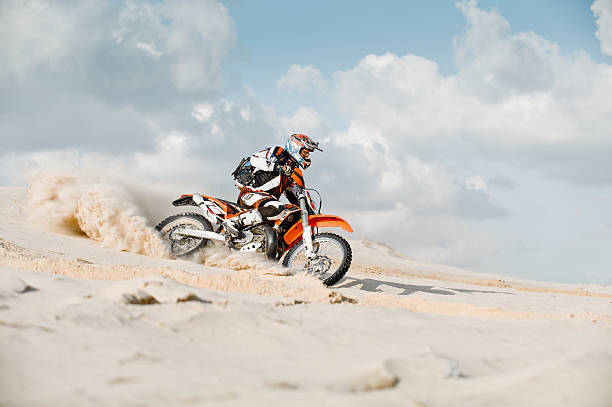 Art Photography motor cross riding over sand