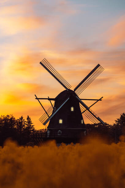 Art Photography Old traditional wooden windmill in a