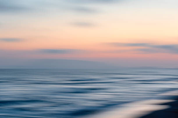 Valokuvataide Panning on seascape at sunset with