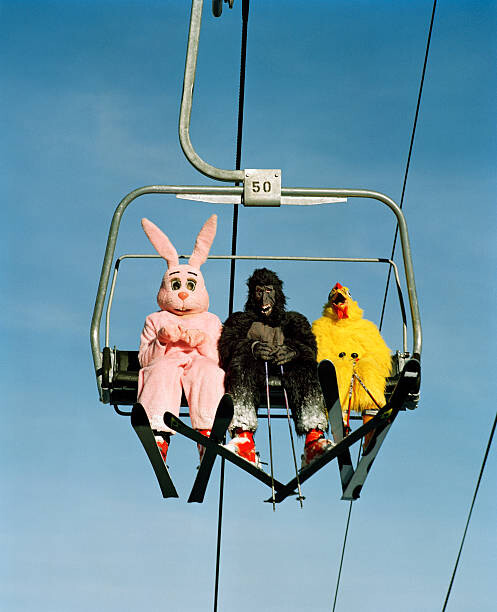 Arte Fotográfica People wearing animal costumes riding ski lift