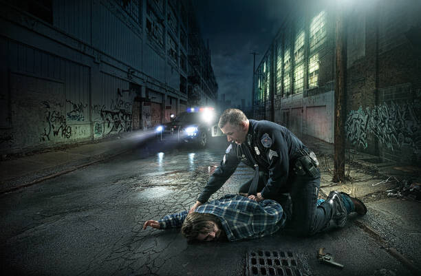 Art Photography Policeman arresting man on city street