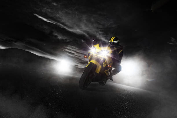Art Photography Supersport motorcycle driver at night with
