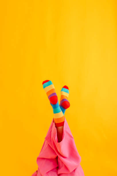Art Photography Woman wearing colorful socks against yellow