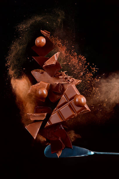 Sticker Broken chocolate pieces balancing on a