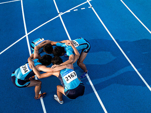 Canvas Print Athletes making a circle