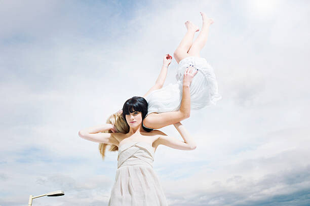 Canvas Print beautiful woman carrying woman on shoulders