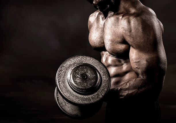 Canvas Print Bodybuilder performing power lift curl