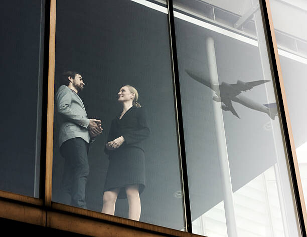 Canvas Print Business Travellers With Airplane Reflecting