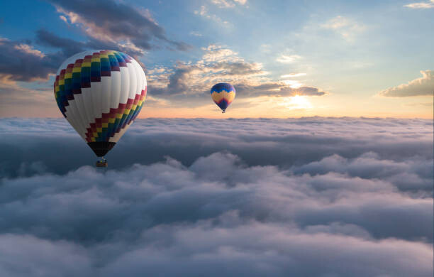 Canvas Print Colorful hot air balloon flying above the clouds