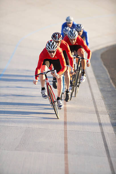 Canvas Print Cyclists in action on velodrome track