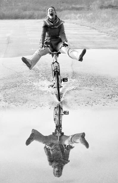 Canvas Print Ecstatic screaming mid adult woman cycling