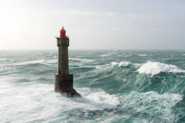 Canvas Print Énorme vague au phare de la