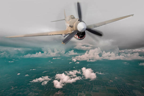 Canvas Print Historical plane flying in sky