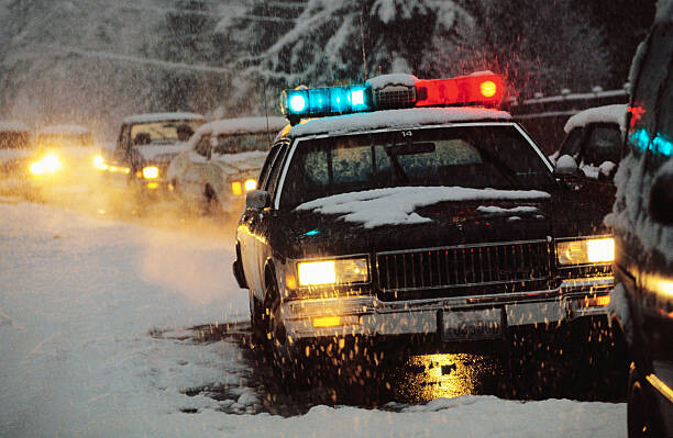 Canvas Print Police Car at Winter Accident Scene