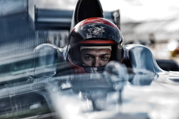 Canvas Print Racer sitting in car