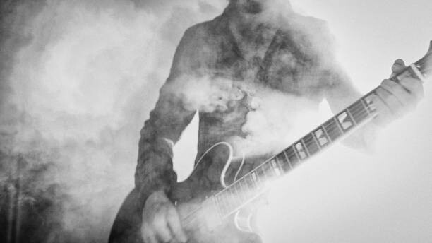 Canvas Print Rock guitarist playing guitar in a