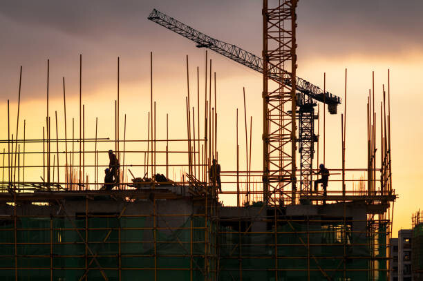 Canvas Print Silhouette of engineer and construction team