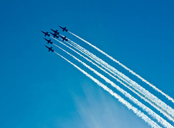 Canvas Print Silhouettes of seven fighter planes with