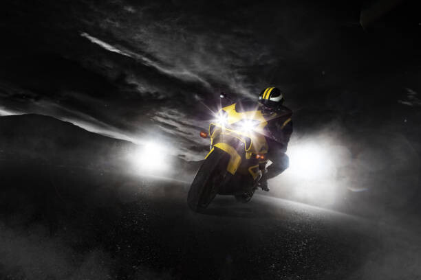 Canvas Print Supersport motorcycle driver at night with
