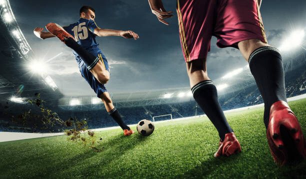Canvas Print Two men are playing soccer and