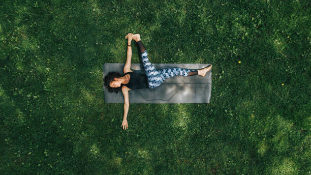 Canvas Print Woman doing Yoga in the Park