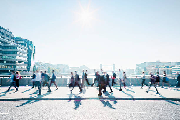 Canvas Print Workers walking to work through the city.