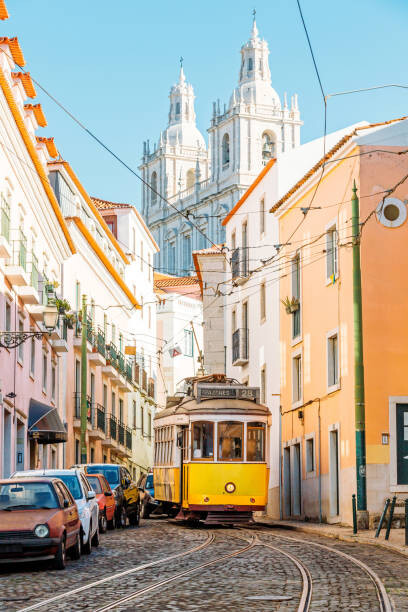 Canvas Print Yellow tram on the narrow street