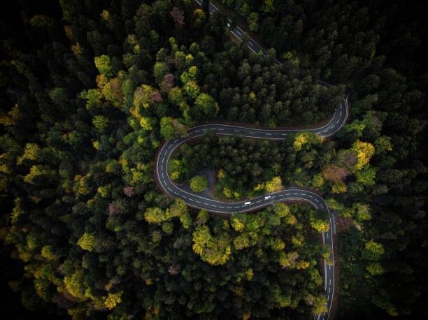 Sticker Curvy mountain road winding through a